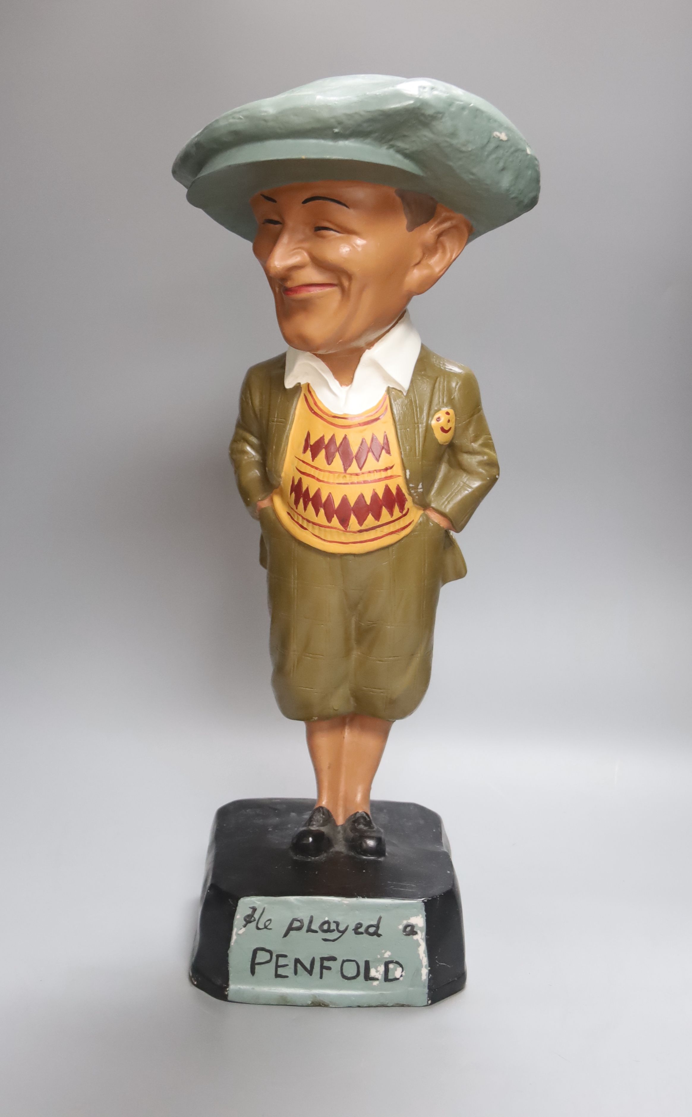 A composition golfing figure He played a Penfold, height 50cm